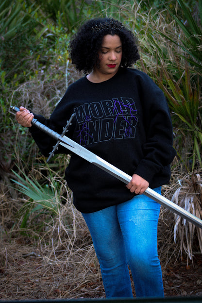 Person wearing a black sweatshirt with 'World Ender' text, holding a sword in an outdoor setting.